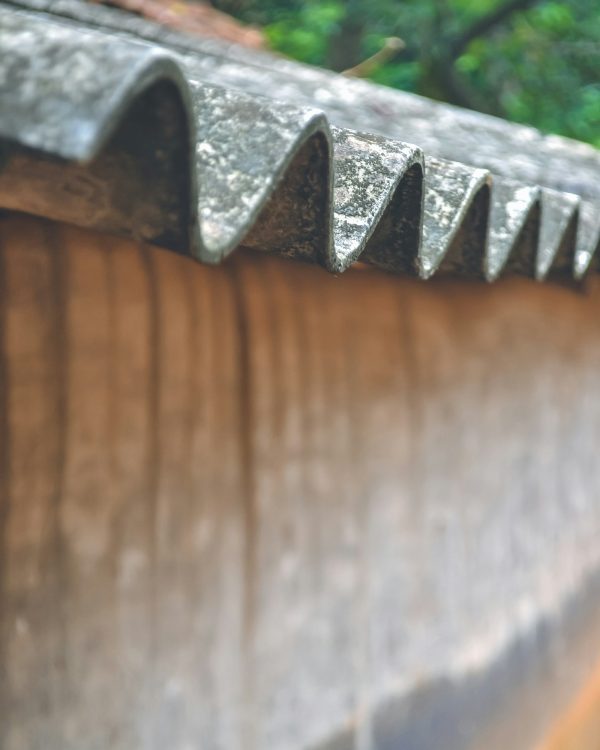 A closeup of the asbestos roof of a mud hut....