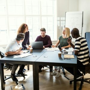 Designers working on a project together in an office