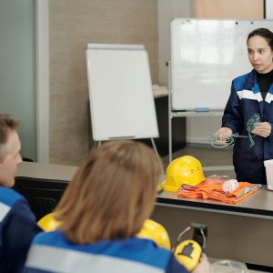 Occupational safety instructor explaining how to give first aid