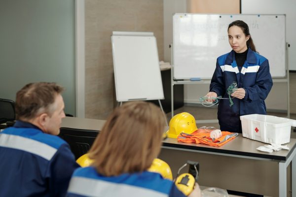 Occupational safety instructor explaining how to give first aid